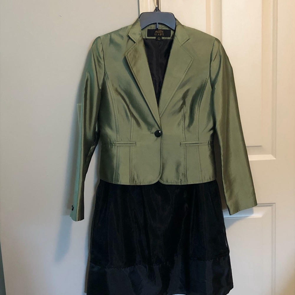 Black skirt with chiffon overlay with green jacket
